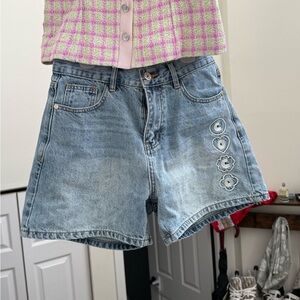 CHANEL Light Blue Denim Shorts with Decorative Side Motifs